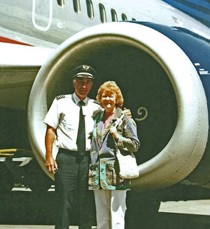Lee and Barb standing in front of a 737 engine